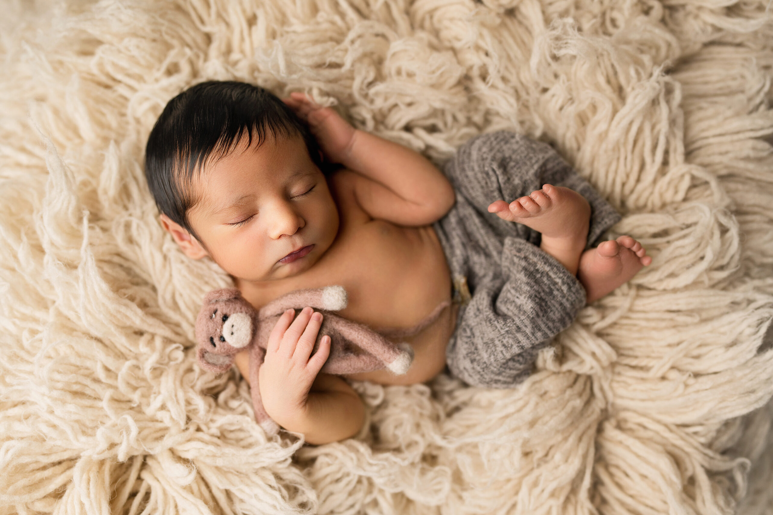Sleeping newborn baby photographed at Inspijoy Photography in Oviedo, Florida